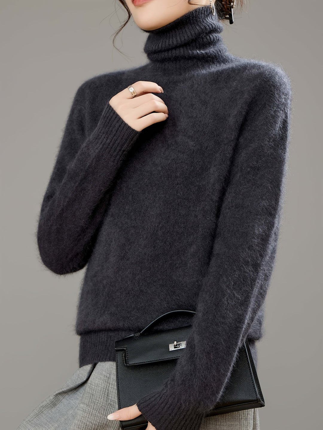 Oversized knit turtleneck sweater for women, a cozy and relaxed fit in a solid color.