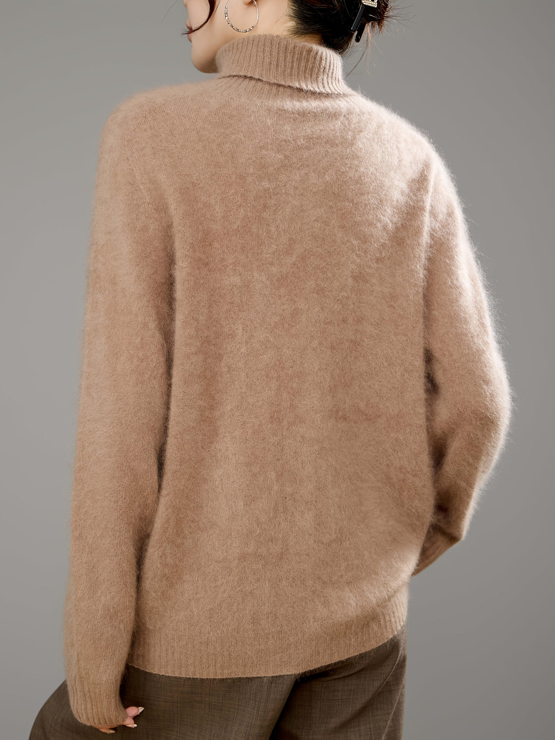 Super soft, cozy women's turtleneck sweater with a relaxed, elegant fit for winter warmth.