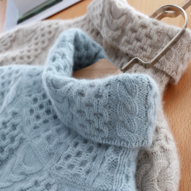 Stylish women's checkered turtleneck sweater, a warm knit top for elegant fall and winter outfits.