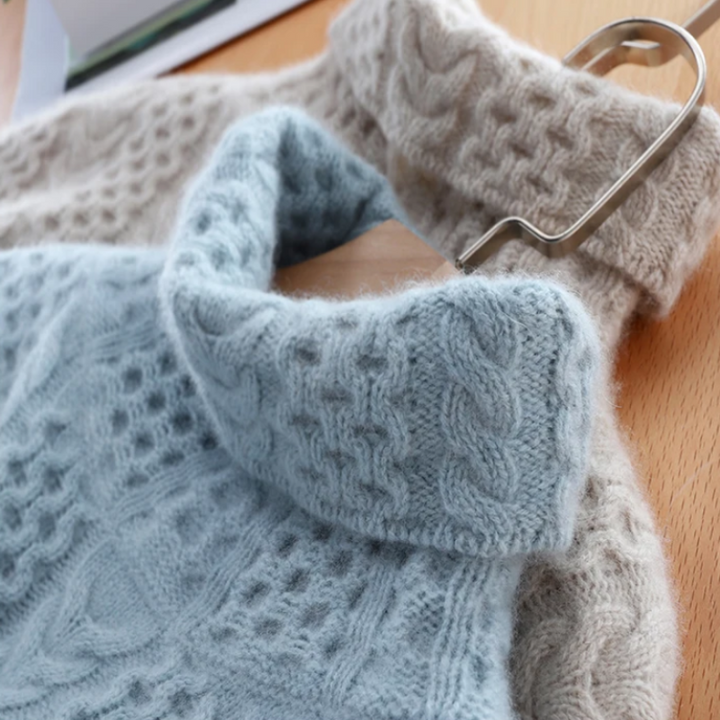 Stylish women's checkered turtleneck sweater, a warm knit top for elegant fall and winter outfits.