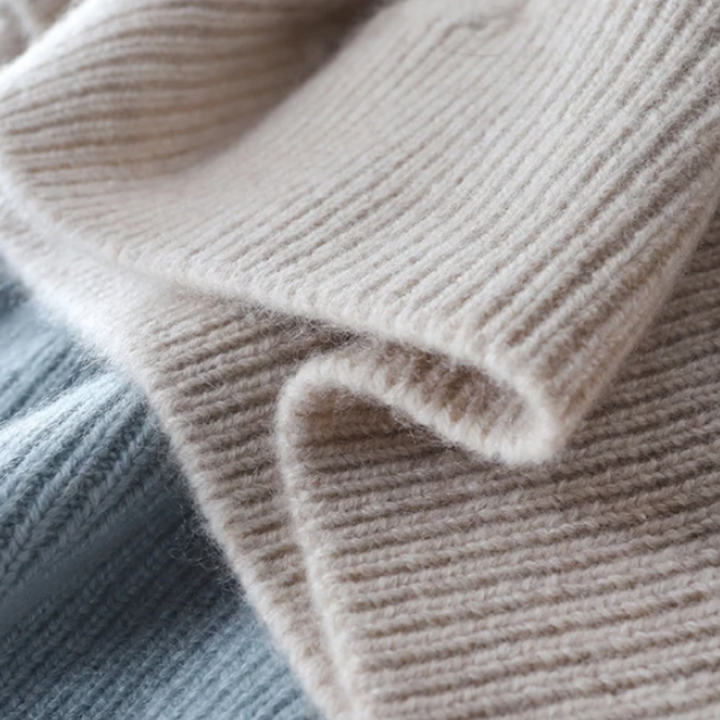 Versatile women's checkered turtleneck sweater, an elegant and warm top for any cold-weather occasion.