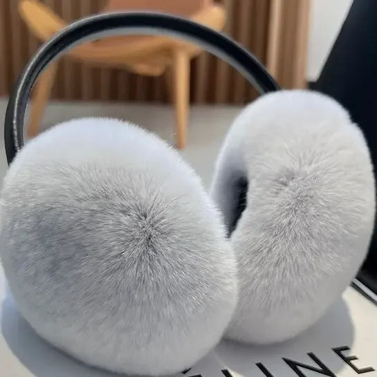 Elegant women's faux fur earmuffs, ultra-soft, providing warmth and style. Perfect winter fashion accessory for cold ears.
