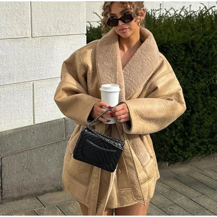 Women's luxury Mirabelle winter coat, crafted from elegant leather and fur for warmth and chic style.