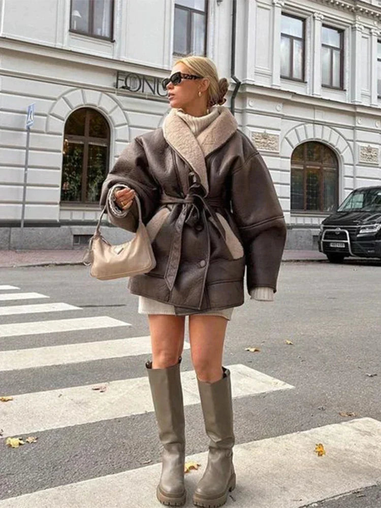 High-end women's Mirabelle winter coat, a luxurious leather and fur jacket for elegant cold weather fashion.