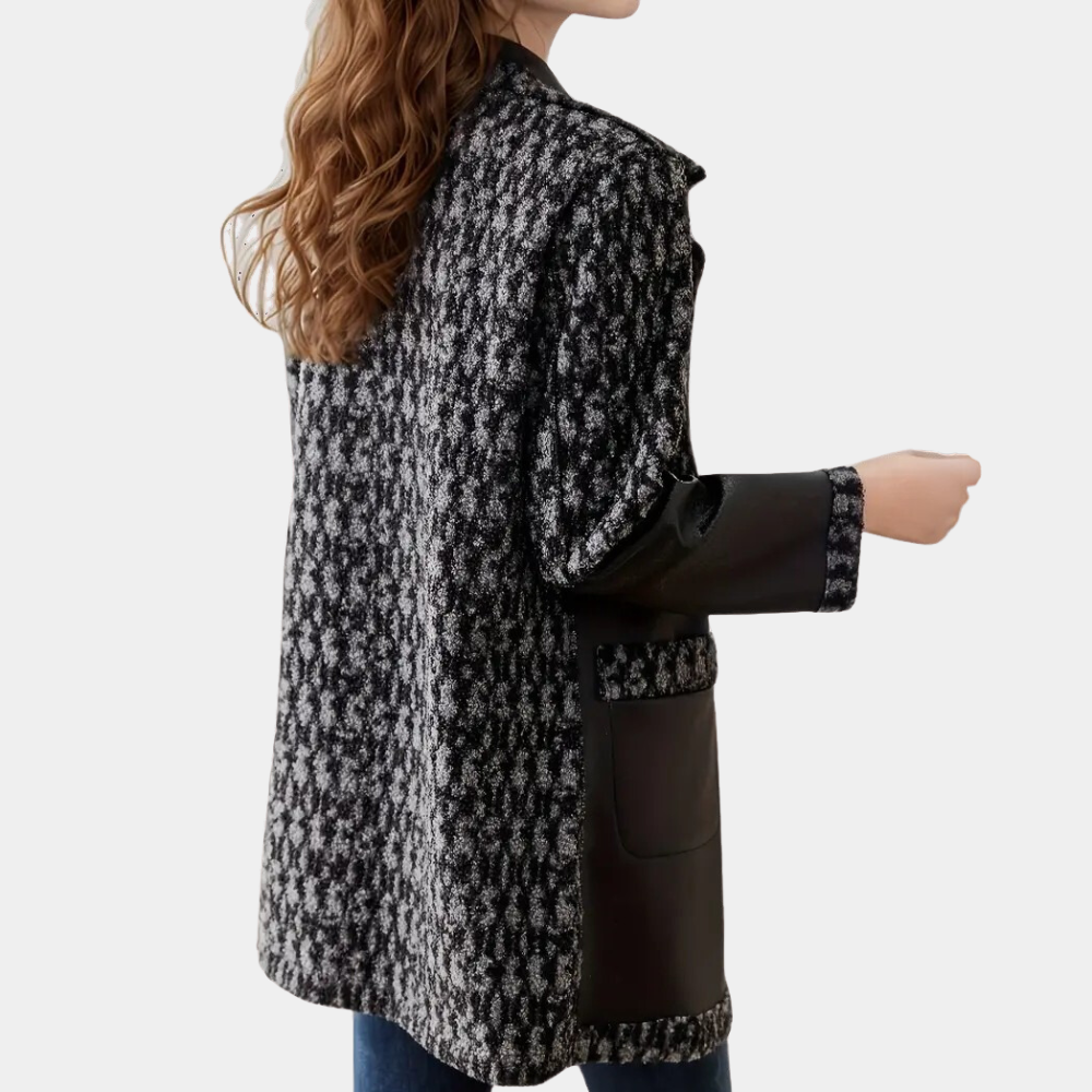 Chic black women's winter coat, luxury tailored fit for elegant cold weather fashion.