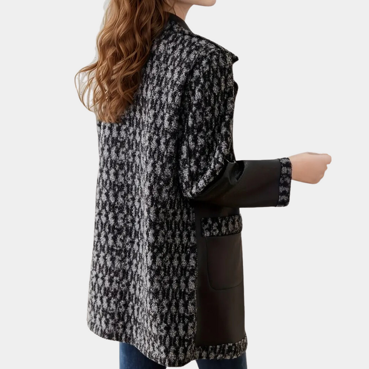 Chic black women's winter coat, luxury tailored fit for elegant cold weather fashion.