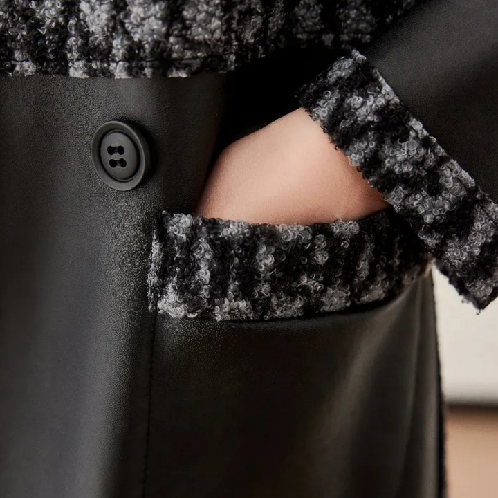 Elegant black luxury women's winter coat, perfect warm outerwear for chic cold weather style.