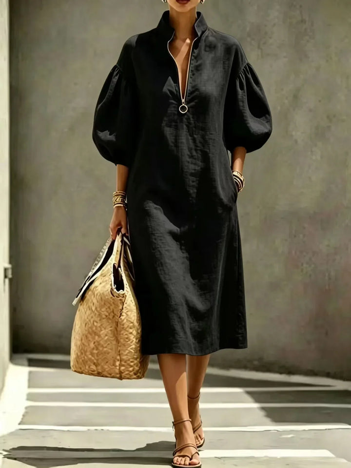 Versatile Women's Madelyn midi dress. Chic, comfortable, and casual with a stylish half-zip and bubble sleeves.