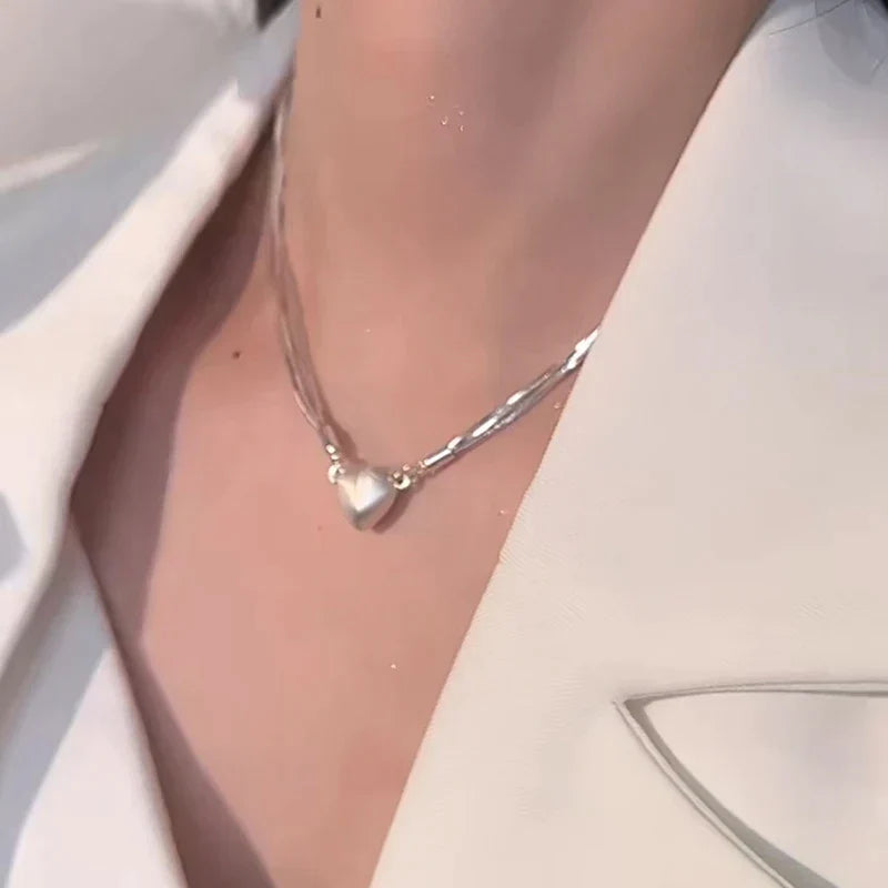 Sterling silver magnetic love heart pendant necklace for women, elegant jewelry gift, adjustable chain for her.