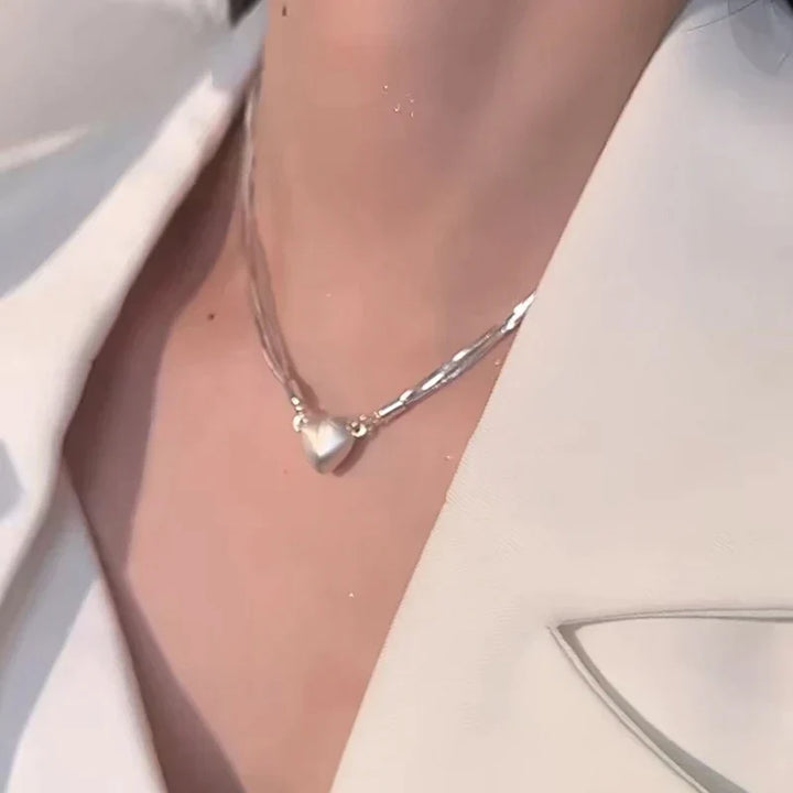 Sterling silver magnetic love heart pendant necklace for women, elegant jewelry gift, adjustable chain for her.