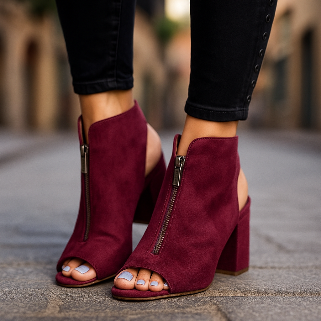 Women's Marcelline zip block heels in black. Open-toe design with modern style, perfect for day to night wear.