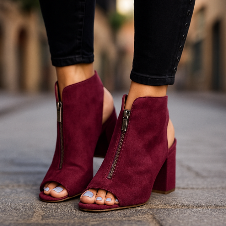 Women's Marcelline zip block heels in black. Open-toe design with modern style, perfect for day to night wear.