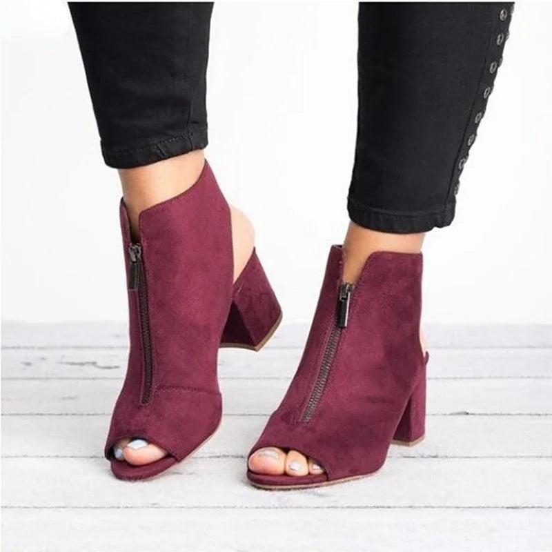 Black Marcelline zip heels for women. Stylish open-toe block heels offer modern elegance & comfort for dress wear.