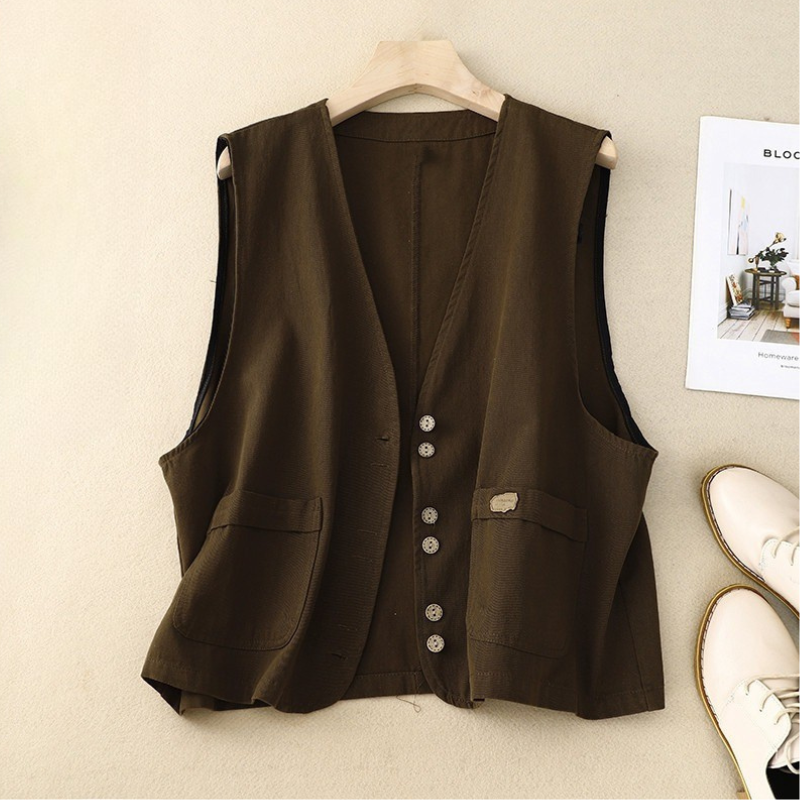 Chic women's sleeveless cotton-linen vest with button front. Versatile for layering, comfortable casual style.