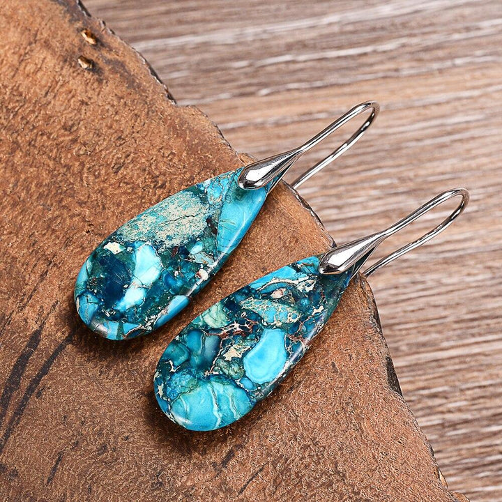 Unique Marisol Ocean Energy drop earrings. Handmade protective women's jewelry with regaliet stone, promoting calming spiritual energy.