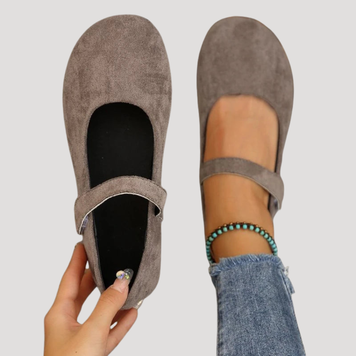 Classic style women's Mary Jane flats with a secure buckle strap, comfortable for versatile daily wear.
