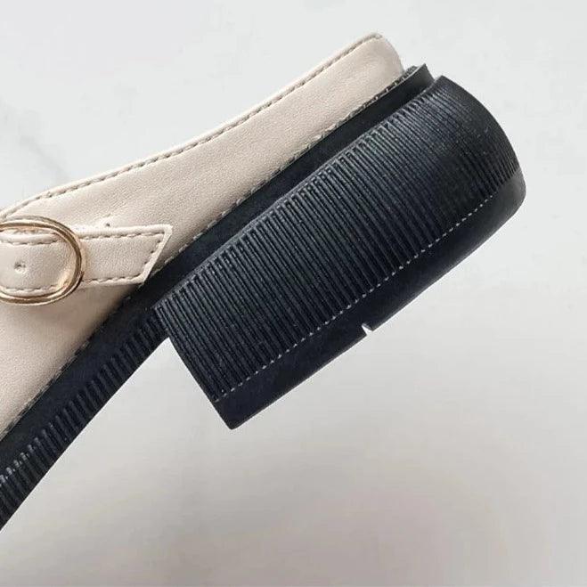 Women's classic Mary Jane pumps with a prominent, elegant buckle and mid heel.