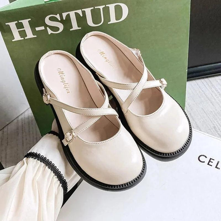 Elegant women's Mary Jane pumps with a sophisticated buckle, ideal for formal occasions.