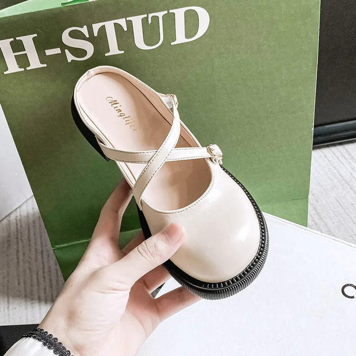 Classic women's Mary Jane pumps featuring a mid heel and elegant buckle for comfort.