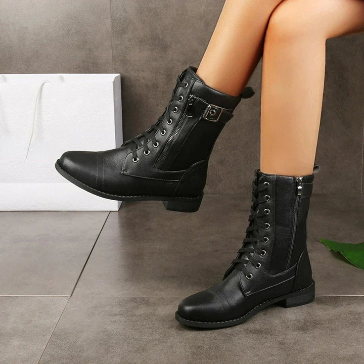 Chic women's Mason mid-calf boots with decorative buckles, functional zipper, & comfortable lace-up fit.