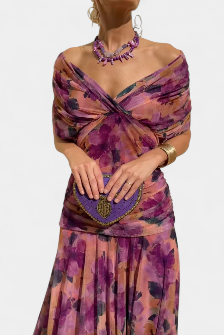 Flattering flowing women's maxi dress. Features a chic v-neck and stylish ruched waist. Comfortable fashion.