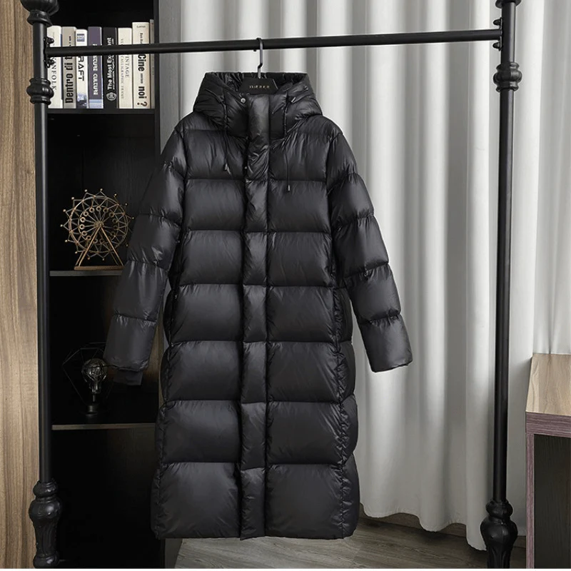 Stylish women's maxi quilted hooded jacket, essential for cold weather & fall fashion.