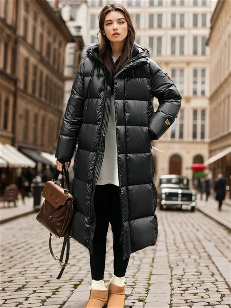 Full-length women's quilted winter jacket with hood, warm and comfortable outerwear.