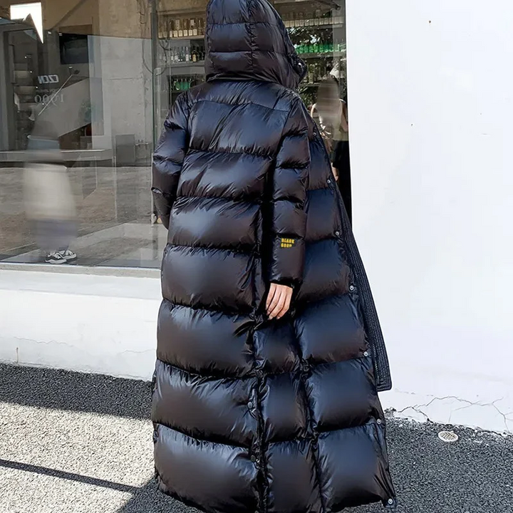 Maxi length women's hooded quilted coat, ideal for severe cold & winter protection.