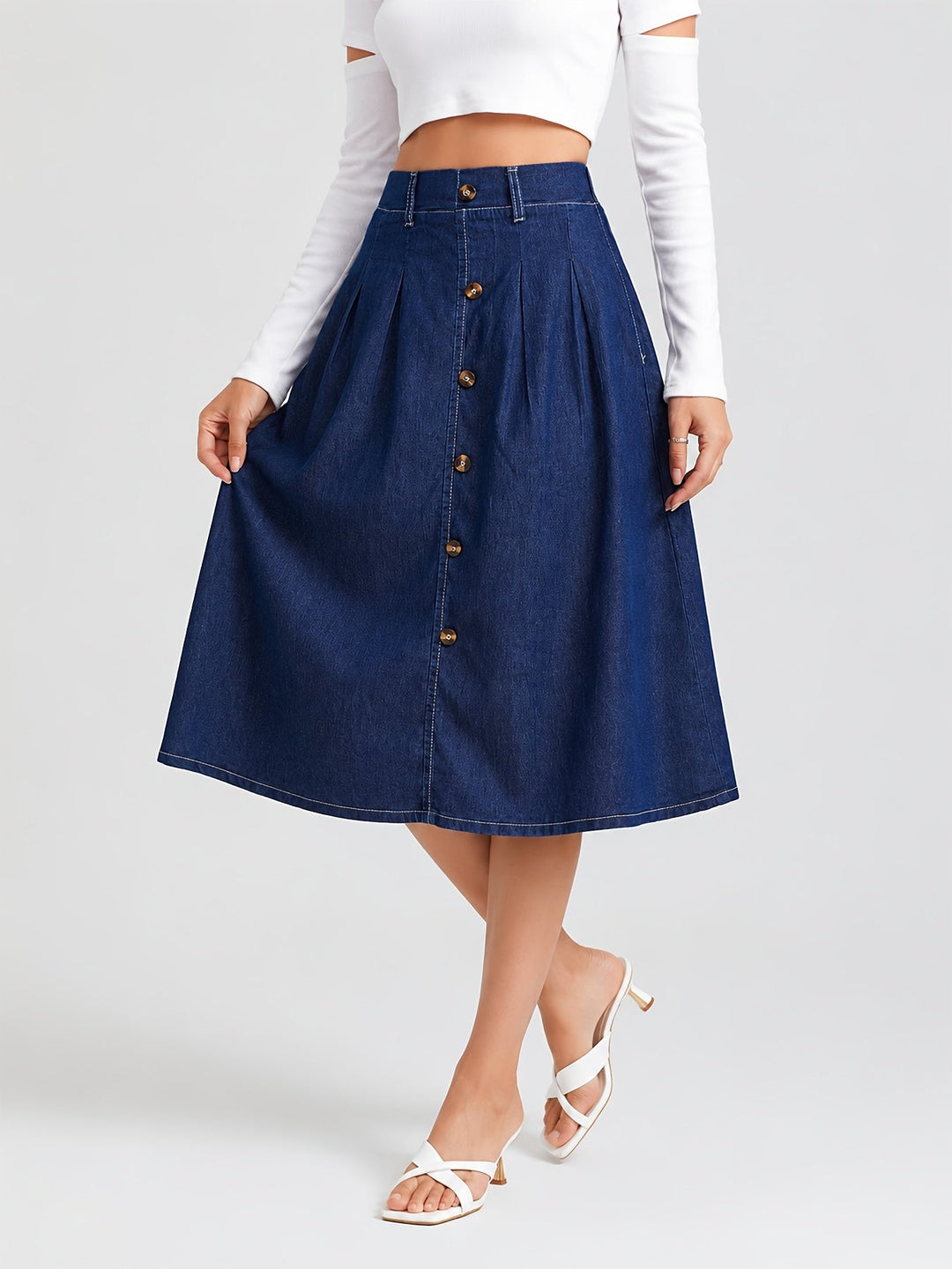 Women's medium blue button-front A-line pleated midi skirt for casual everyday style. Versatile chic fashion.