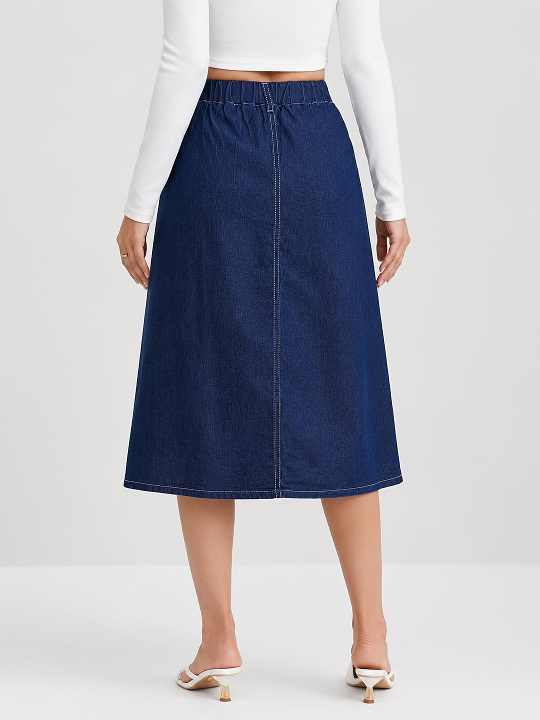 Chic medium blue pleated A-line midi skirt, button-front design. Ideal for versatile casual and everyday fashion.