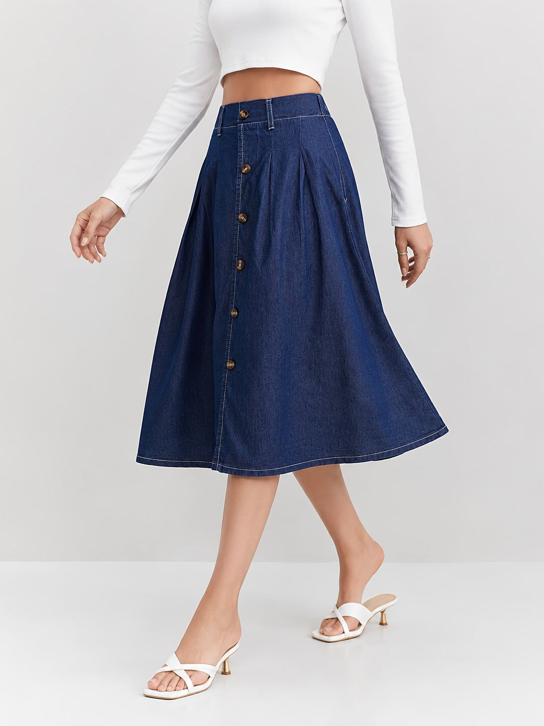 Stylish women's medium blue button-front A-line midi skirt. Pleated for flattering everyday chic fashion.