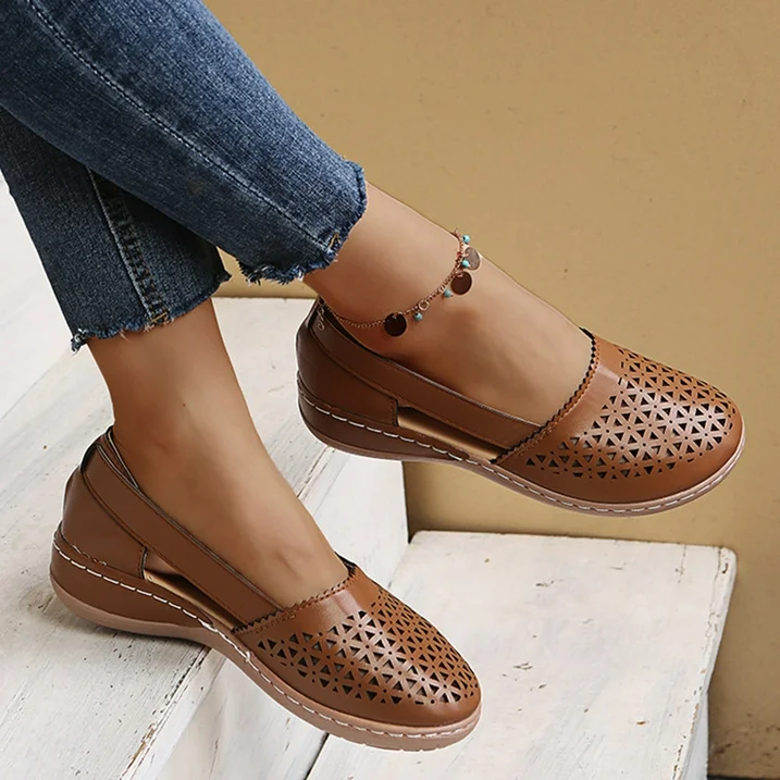 Woman wearing Melina comfortable summer shoes while walking outdoors.
