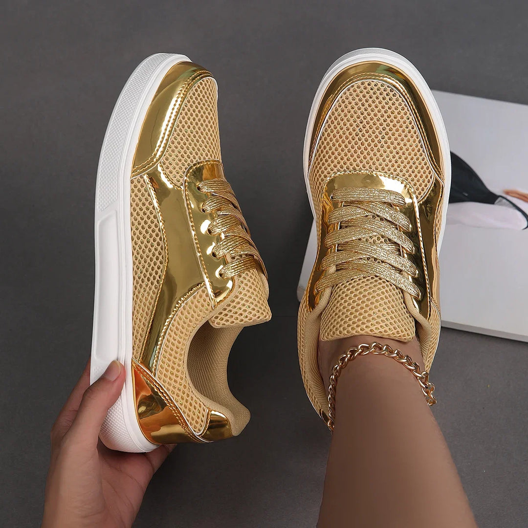 Stylish women's metallic mesh sneakers. Shimmering, chic lace-up fashion footwear for a trendy look.