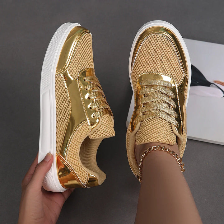 Stylish women's metallic mesh sneakers. Shimmering, chic lace-up fashion footwear for a trendy look.