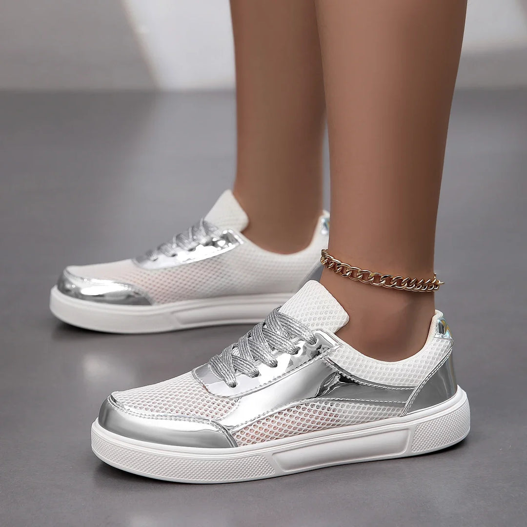 Elegant women's metallic mesh sneakers. Chic, breathable lace-up fashion shoes for modern style & comfort.