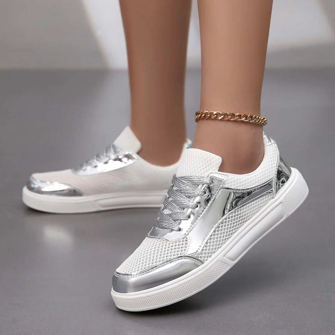 Front view: Women's metallic mesh sneakers. Breathable, chic lace-up design with a shimmering, stylish finish.