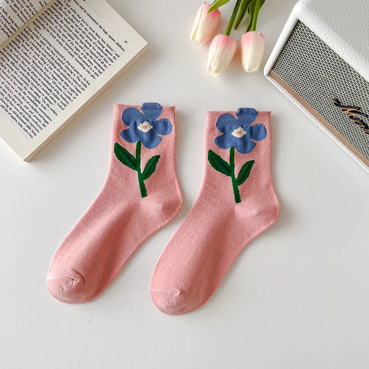 Versatile women's mid-calf floral socks. 5-pack of comfortable, stylish cotton blend patterned socks for daily wear.