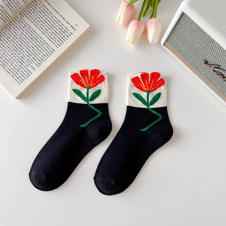 Trendy women's mid-calf floral socks. 5-pair cotton blend pack, comfortable & breathable patterned designs.