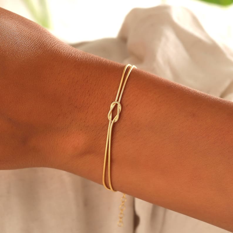Everyday essential: women's gold minimalist knot bracelet, easy to style.
