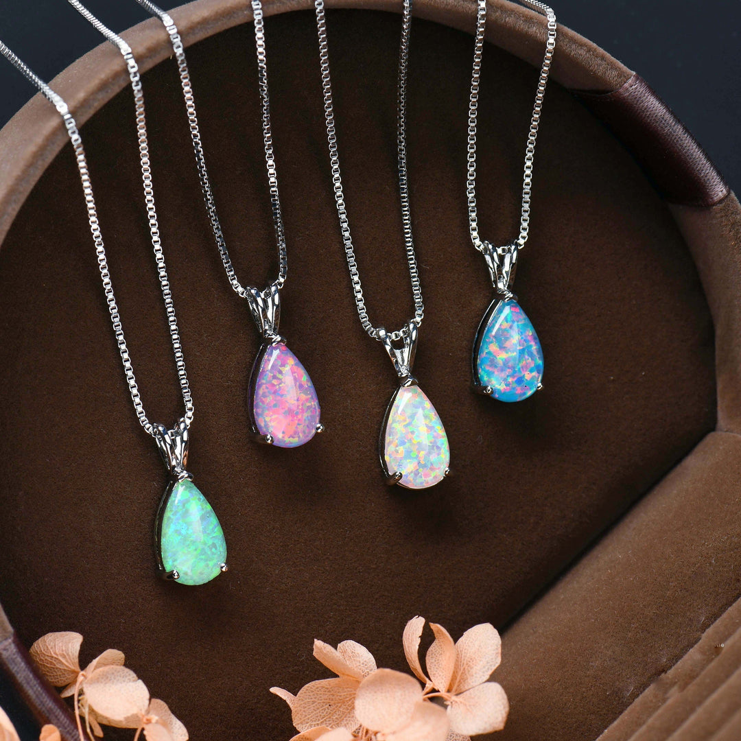 Women's minimalist opal drop pendant necklace. Elegant rose gold finish, perfect gift for her.