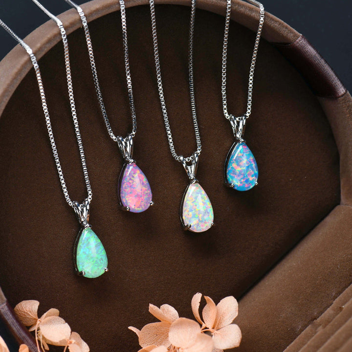 Women's minimalist opal drop pendant necklace. Elegant rose gold finish, perfect gift for her.