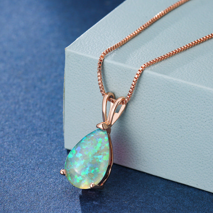Silver minimalist opal necklace with drop pendant. Versatile women's jewelry for any occasion.