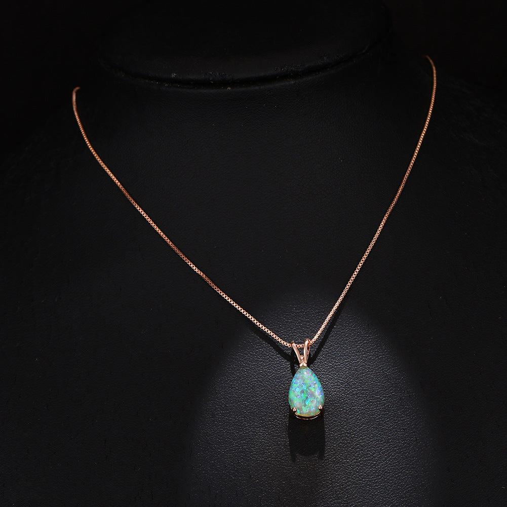 Minimalist women's opal drop pendant. Elegant gemstone necklace, adjustable chain for comfort.