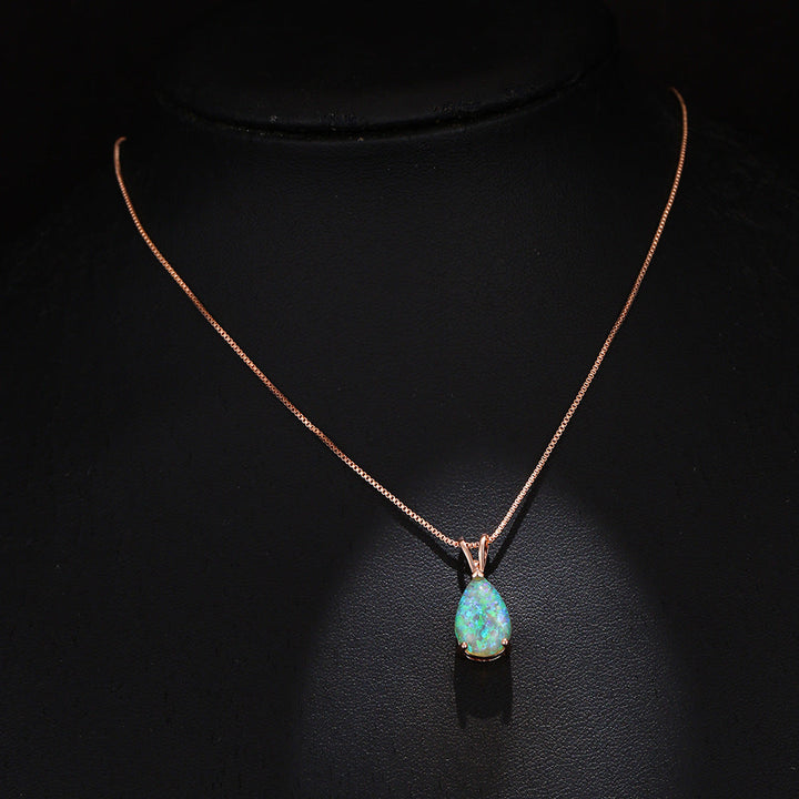 Minimalist women's opal drop pendant. Elegant gemstone necklace, adjustable chain for comfort.