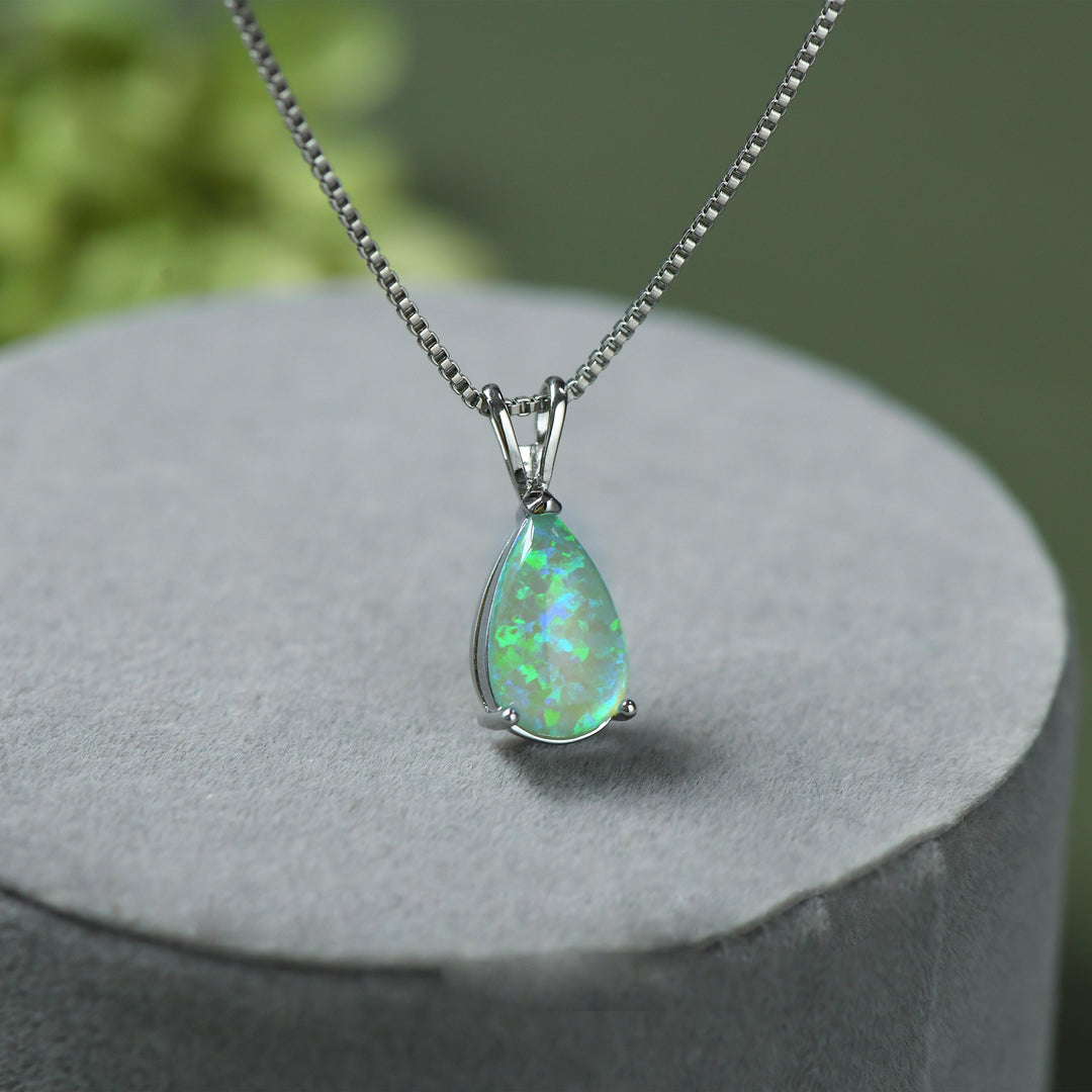 Elegant silver opal drop pendant. Minimalist women's jewelry, delicate and adjustable necklace.