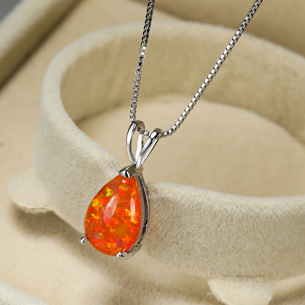 Women's opal drop pendant. Minimalist design with an iridescent gemstone. Silver finish available.