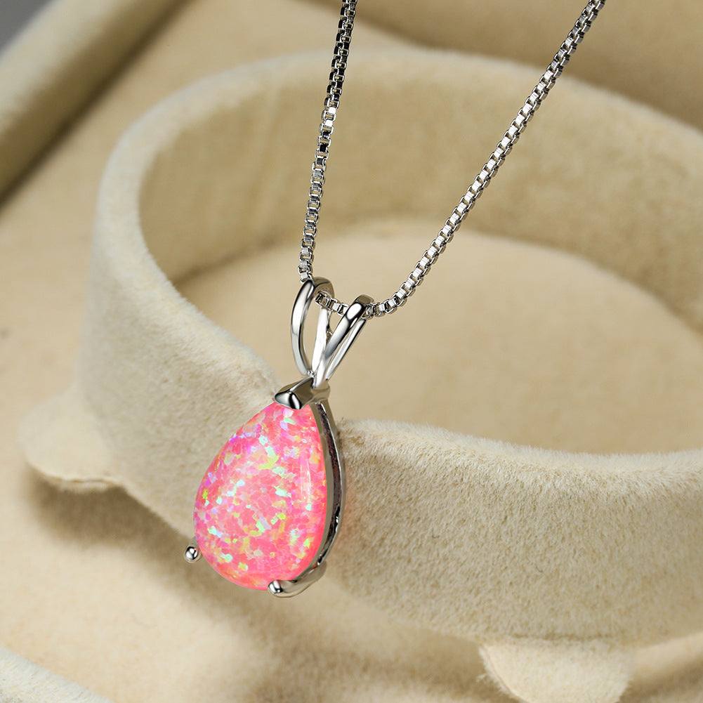 Silver women's minimalist opal drop necklace. Elegant gemstone pendant, ideal for gifting.