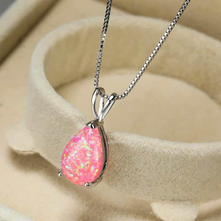 Silver women's minimalist opal drop necklace. Elegant gemstone pendant, ideal for gifting.