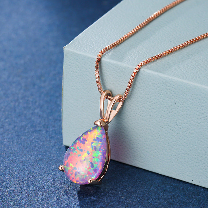 Minimalist opal drop pendant necklace. Versatile women's jewelry, rose gold, adjustable chain.