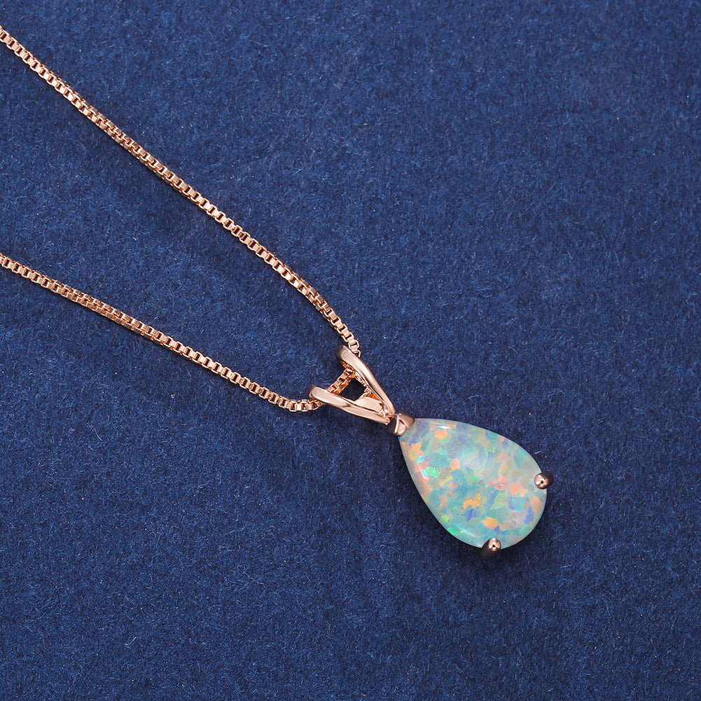 Rose gold minimalist opal drop pendant necklace. Dainty women's jewelry with adjustable chain.
